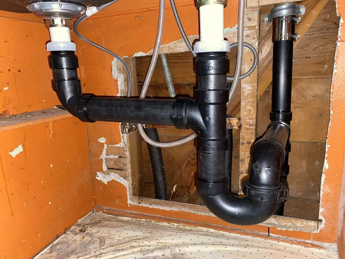 Professional Garbage Disposal Repair equipment and tools on the job in Sunset